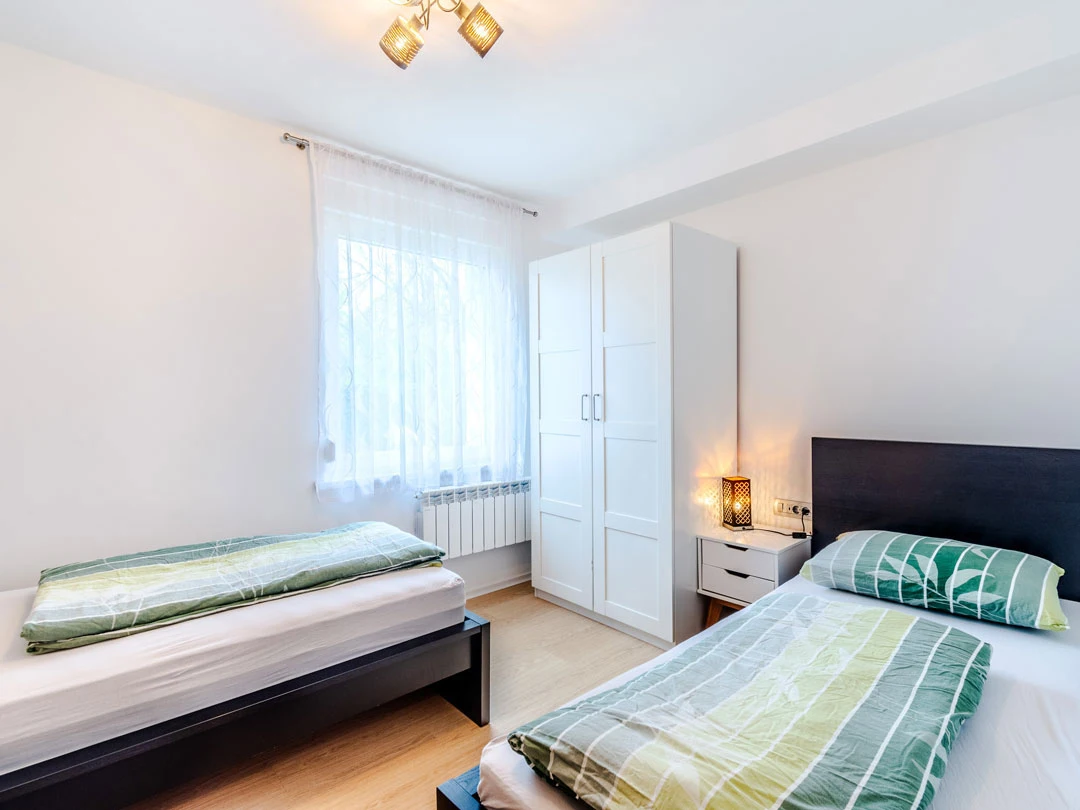 bedroom with two beds - apartment lev