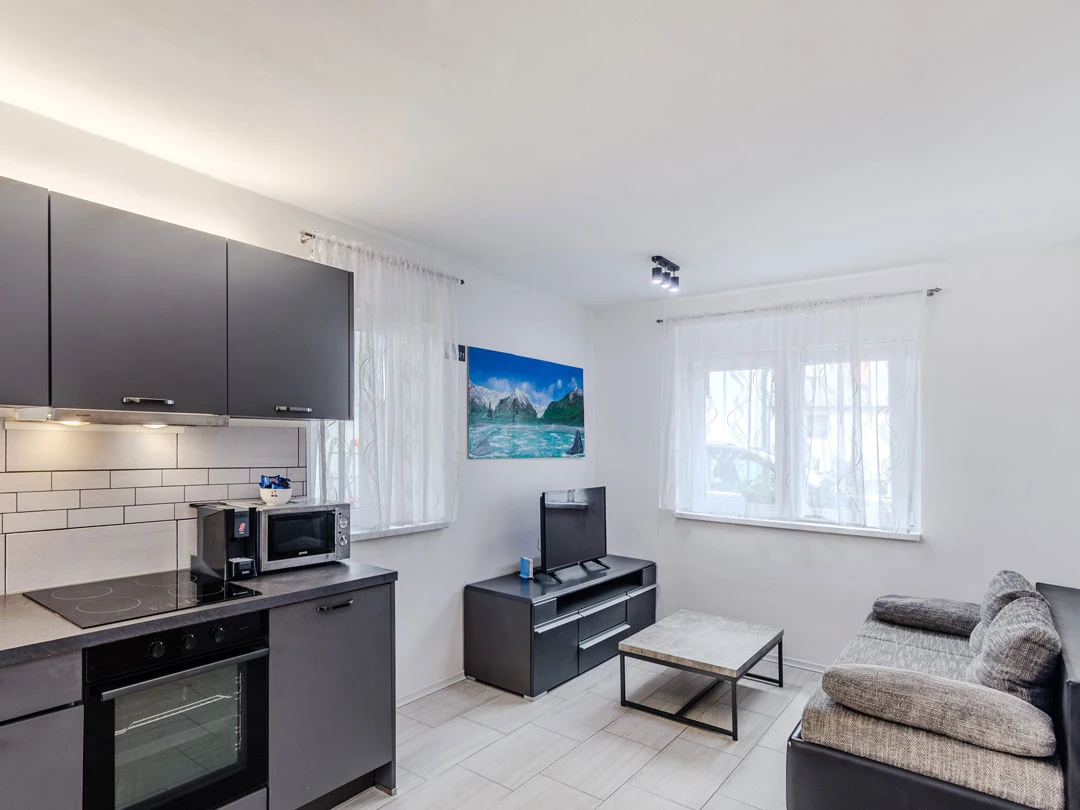 living room with a tv - apartment time out